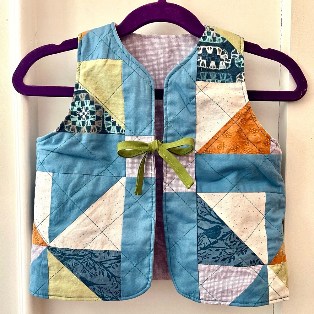 Handmade quilted patchwork vest for toddlers. Reversible